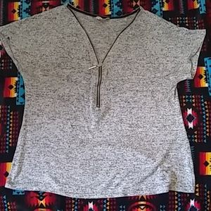 A gray zip-up blouse
